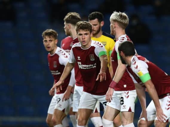 Cobblers players were found wanting at the Kassam. Pictures: Pete Norton