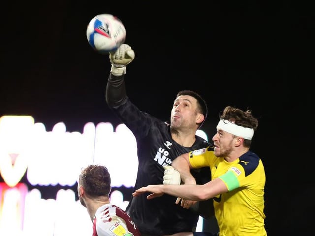Appeared to misjudge the flight of the ball and was slow on his feet as Clare's cross looped over him for Taylor to head in. Also got a hand to Taylor's second. Four of Oxford's five shots on target ended up in his net... 4