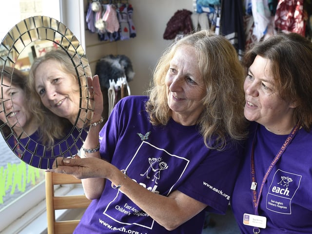 Sue Reeves (dark hair) and Debbie Gibbs (light hair) from the East Anglian Childrens' Hospice charity shop , Whittlesey taking part in a charity head shave. EMN-201217-144128009