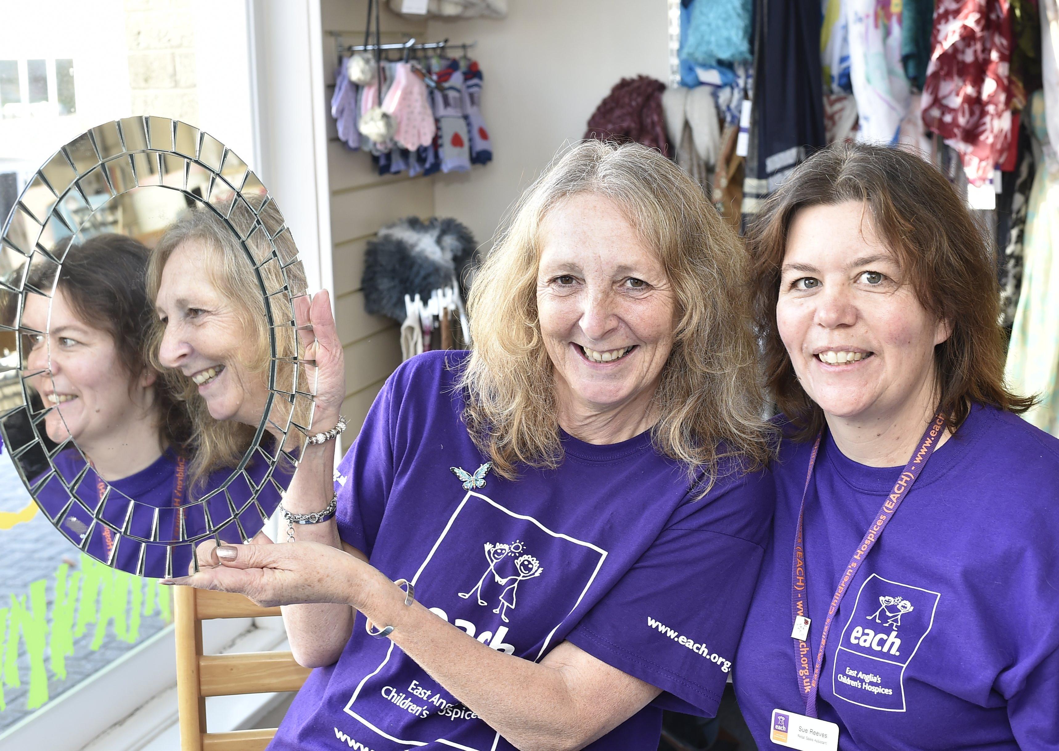 Sue Reeves (dark hair) and Debbie Gibbs (light hair) from the East Anglian Childrens' Hospice charity shop , Whittlesey taking part in a charity head shave. EMN-201217-144055009