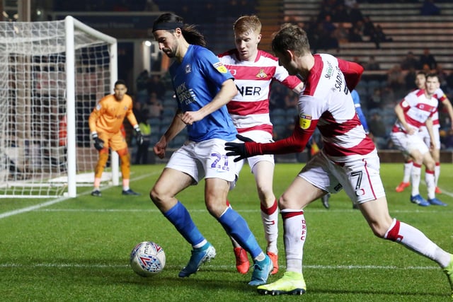 Action from last season's 3-0 Boxing Day defeat at home to Doncaster involving George Boyd (left) and Kieran Sadlier.