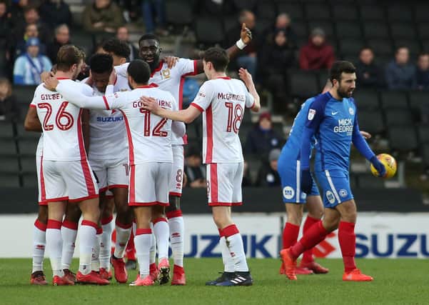 Christmas horror show at MK Dons as they celebrate a goal against Posh on December 30, 2017 when down to 10 men. Photo: Joe Dent