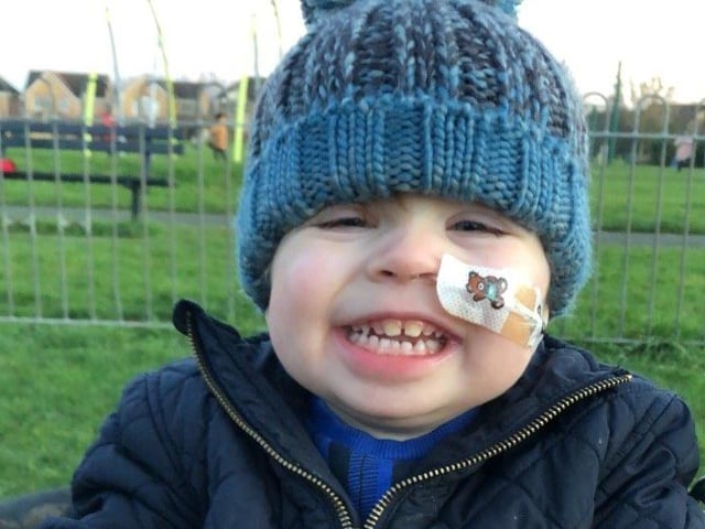 Grayson enjoying time outdoors following his heart transplant operation.