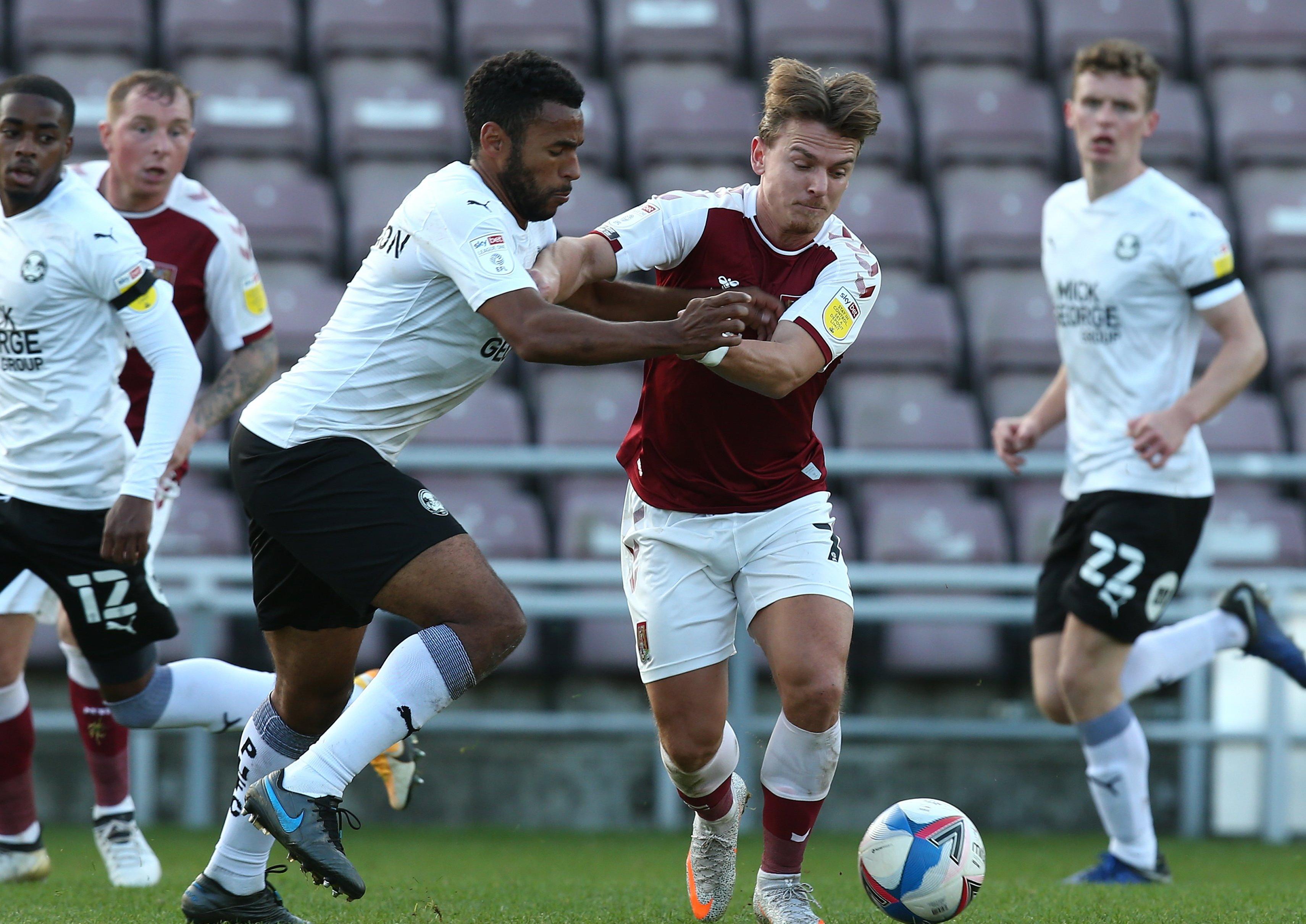 Nathan Thompson (left) in action for Posh against Northampton earlier this season.