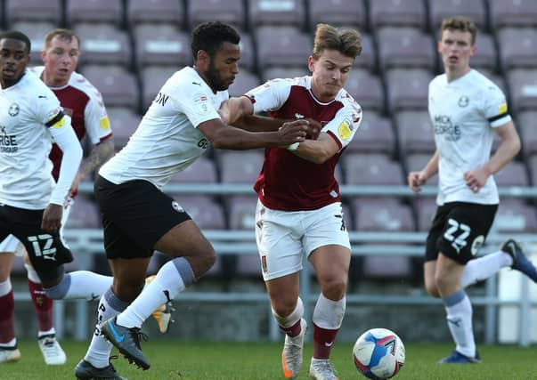 Nathan Thompson (left) in action for Posh against Northampton earlier this season.