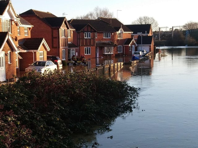Water engulfs homes and vehicles