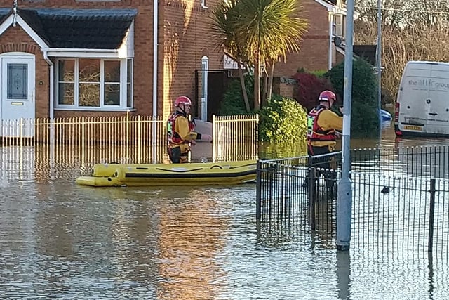Rescuers are taking people from their homes