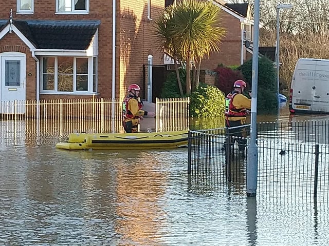 Rescuers are taking people from their homes