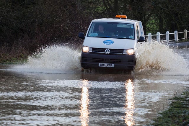 A driver attempting to get through the flood water in Warkton