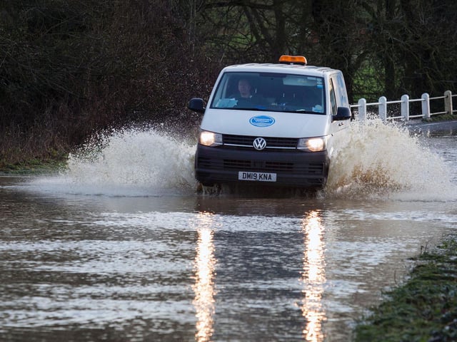 A driver attempting to get through the flood water in Warkton