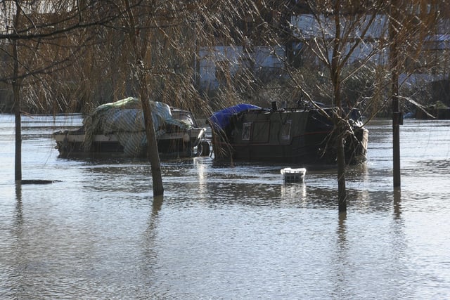 Boats left inaccessible by flood water on Peterborough's Embankment. Picture: David Lowndes