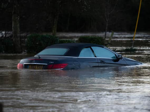 Many cars have been left stranded by the floodwater