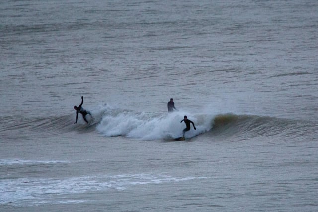 Intrepid surfers at Birling Gap, shortly after dawn on Christmas Eve, taken by Barry Davis with a Canon 5d. SUS-201230-100210001
