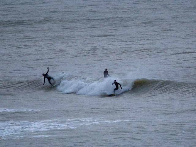 Intrepid surfers at Birling Gap, shortly after dawn on Christmas Eve, taken by Barry Davis with a Canon 5d. SUS-201230-100210001