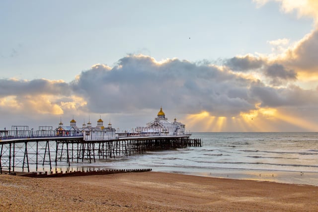 Eastbourne Pier bathed in sunlight with the sun streaming through the clouds. This shot was taken by Barry Davis, with a Canon 5d Mark iii. SUS-201230-102224001