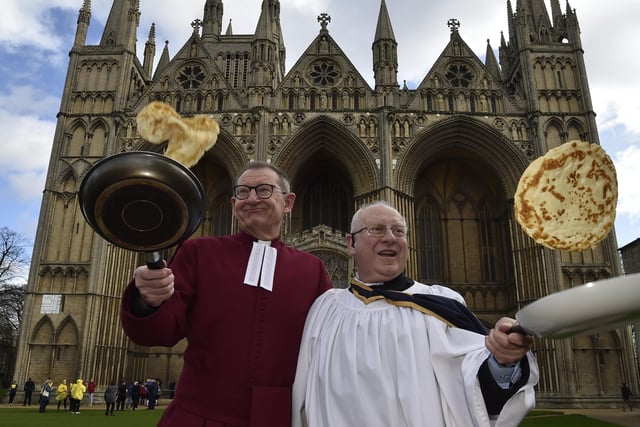 Pancake races at Peterborough Cathedral.  The Very Revd. Christopher Dalliston, Dean of Peterborough Cathedral with head verger David Wood in February.
