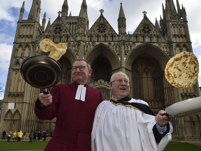 Pancake races at Peterborough Cathedral.  The Very Revd. Christopher Dalliston, Dean of Peterborough Cathedral with head verger David Wood in February.