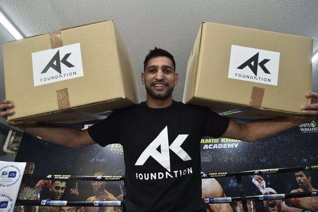 Amir Khan at Topyard Boxing Club, Cromwell Road helping to hand out food for the homeless and needy in May.