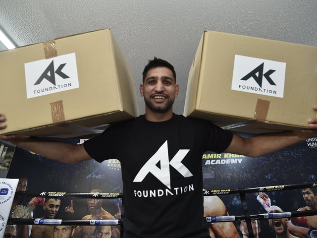 Amir Khan at Topyard Boxing Club, Cromwell Road helping to hand out food for the homeless and needy in May.