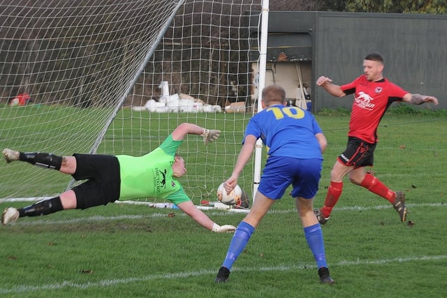 The Peterborough League Premier Division is set for a great title race, if football is allowed to re-start in 2021. Two of the contenders, Stilton United (red) and Peterborough North End Sports, are pictured here with Stilton goalkeeper Dave Beeny at full stretch.