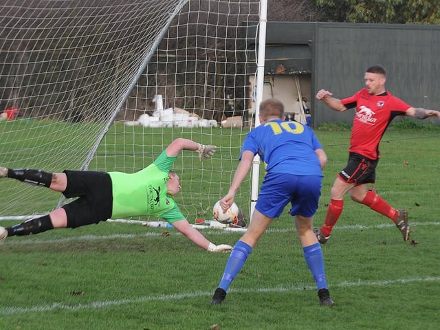 The Peterborough League Premier Division is set for a great title race, if football is allowed to re-start in 2021. Two of the contenders, Stilton United (red) and Peterborough North End Sports, are pictured here with Stilton goalkeeper Dave Beeny at full stretch.