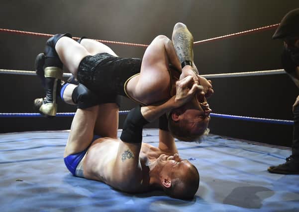 Wrestling returned to Peterborough at the New Theatre. Joey Scott and Alan Lee are the men grappling.