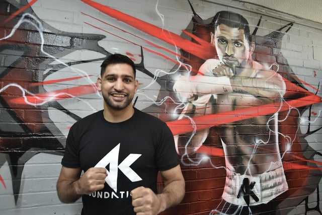 Former world champion Amir Khan opened the new Cromwell Road premises of crack city boxing club Topyard and helped deliver food parcels to those in need while he was there.