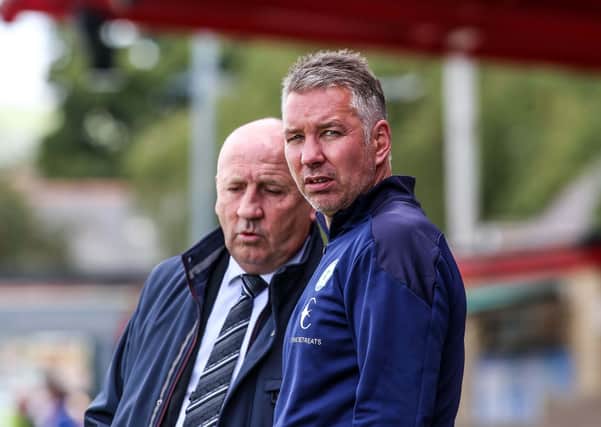 Manager Darren Ferguson with Accrington Stanley manager John Coleman.