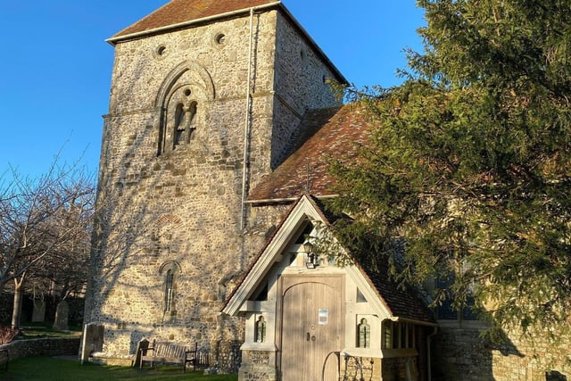 Jevington Church on a sunny New Year's Eve. This picture was taken by Melanie Wells, who said, " I loved the way the tree shadows appeared to be caressing the church tower, as if to say, I’ve got you! It’s been a tough year, but tomorrow is another day and a New Year!" SUS-210601-144328001