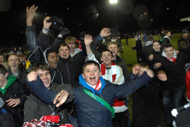 Crawley Town fans on the pitch