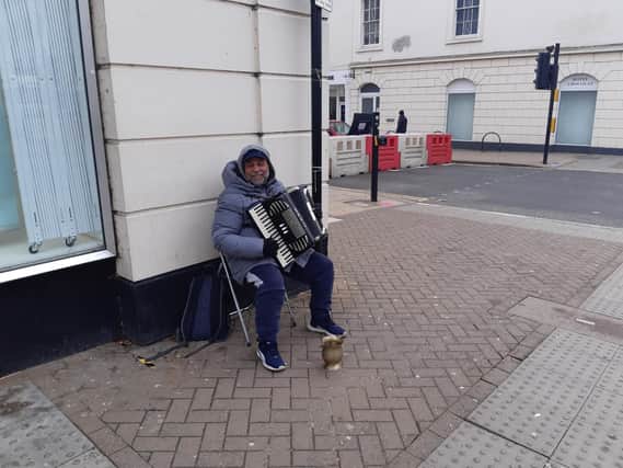 The Accordion-playing busker was sat running through his playlist in his usual spot at the corner of Warwick Street and The Parade despite the freezing cold weather.