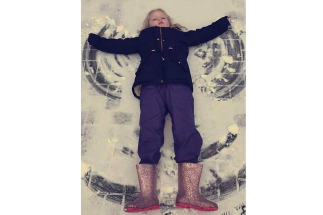 Elise, aged 9, makes a snow angel near her Banbury home (photo from Leone Allsop)