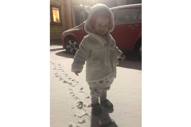 Frankie Lester, aged 21 months, smiles at the sight of his first snow at his home near Peoples Park, Banbury (photo from his mum, Kerry Ann Harris)