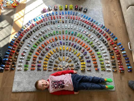 A rainbow of cars by Sophie Lewis-Wells