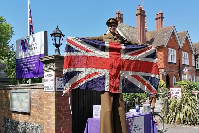 Nick Cook Circus Entertainer Performer pictured on VE Day as a stilt walking WW2 Military Officer