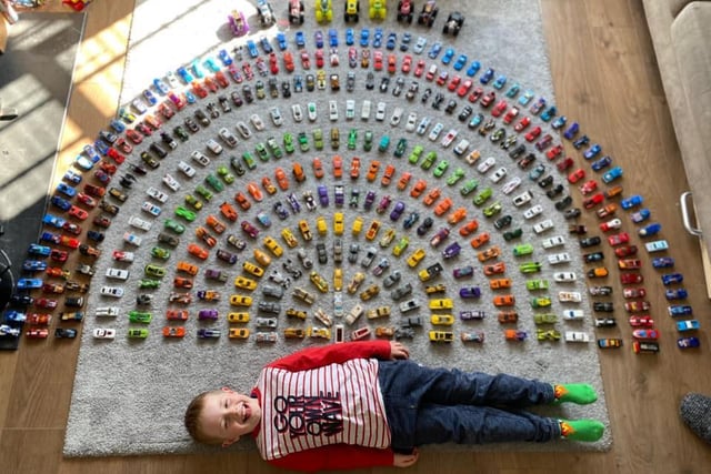 Sophie Lewis-Wells wrote: "Our Rainbow of cars when we were first locked down in 2020."