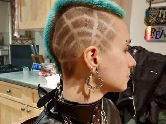 Damien Knight boldly tested out a new spiderweb looking design on his friend's hair with a cut throat razor.