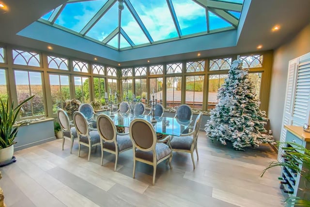 The dining room and conservatory joins onto two out of the house's five reception rooms.