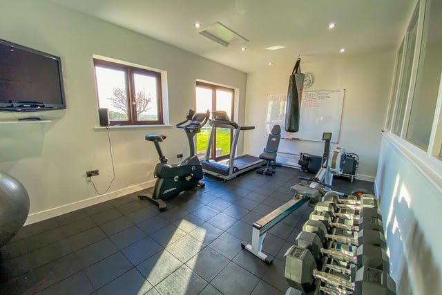 This remarkable home gym joins onto the double garage in one of the outbuildings.