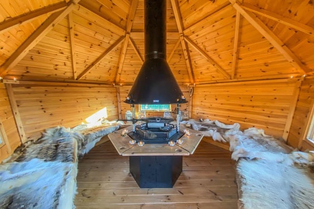 One of the home's hidden gems is the cosy BBQ hut outside.
