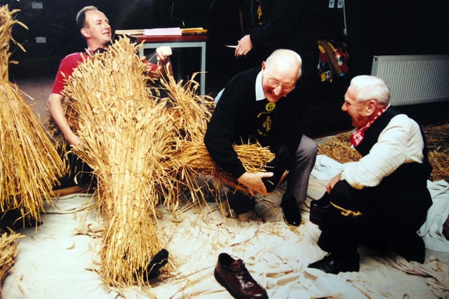 Phil Oldfield gets dressed for the Straw Bear featival in Whittlesey Jan 1996