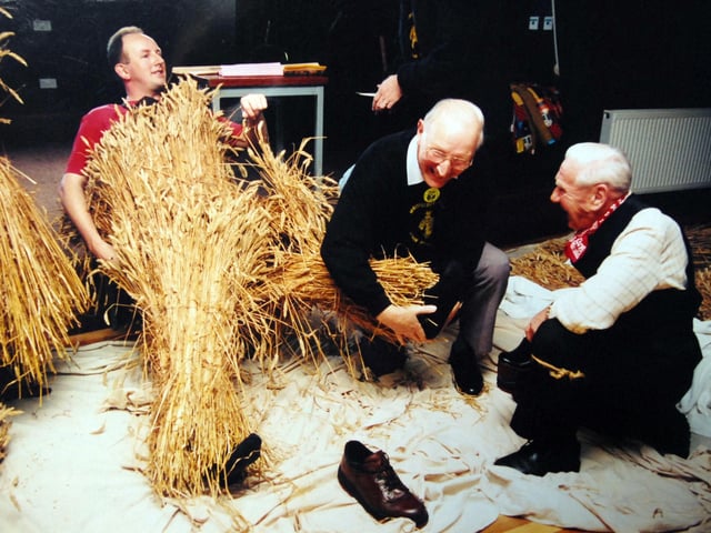 Phil Oldfield gets dressed for the Straw Bear featival in Whittlesey Jan 1996