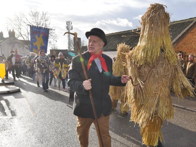 Straw Bear and his keeper leading the parade in 2017.