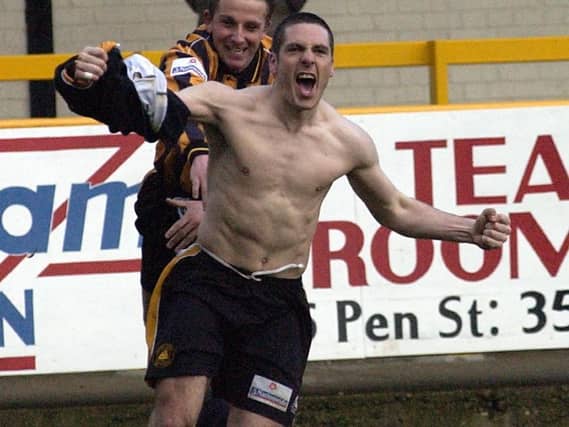 Clare celebrates his third.