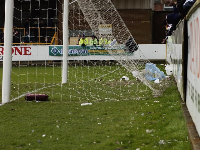 The blustery conditions saw litter swirl about all game.
