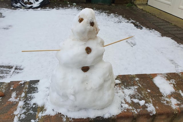 A snowman built by eleven-year-old Noah in Crawley
