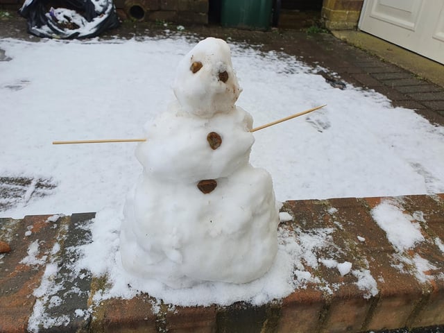A snowman built by eleven-year-old Noah in Crawley