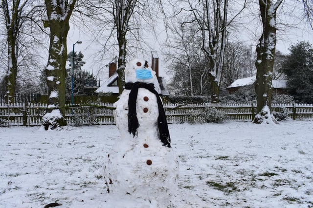 This Whitehall Rec snowman, not wanting to take any chances against the cold or coronavirus, has donned a mask and scarf.