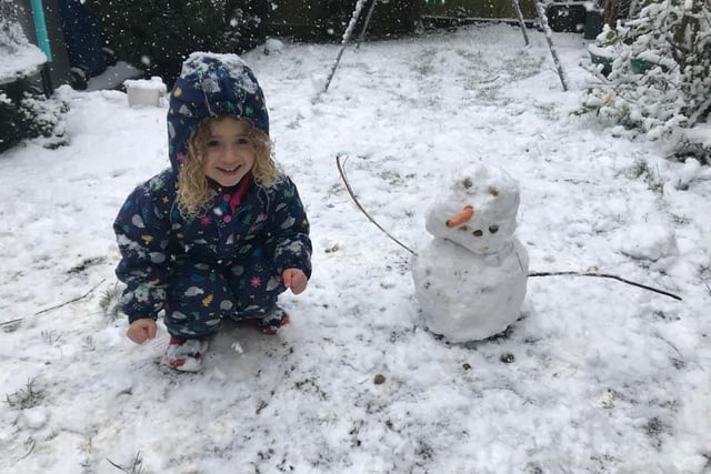 Amelie, four, with her snowman with the longest arms ever! Photo: Becca Johnson-Sutcliffe