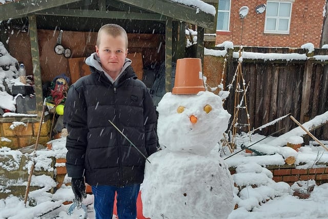 Ben with his snowman. Photo: Susan Poulter
